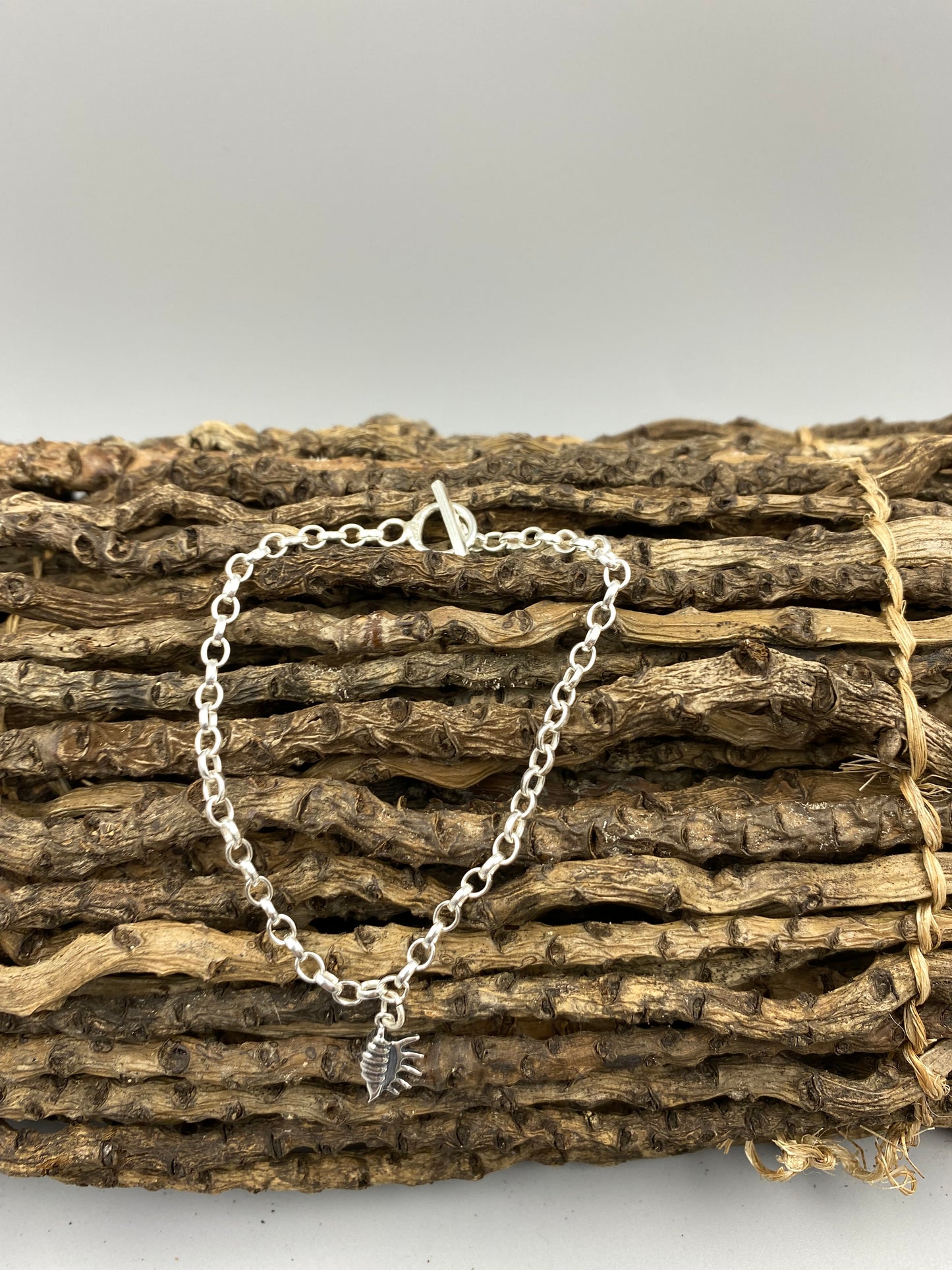Conch shell t bar bracelet
