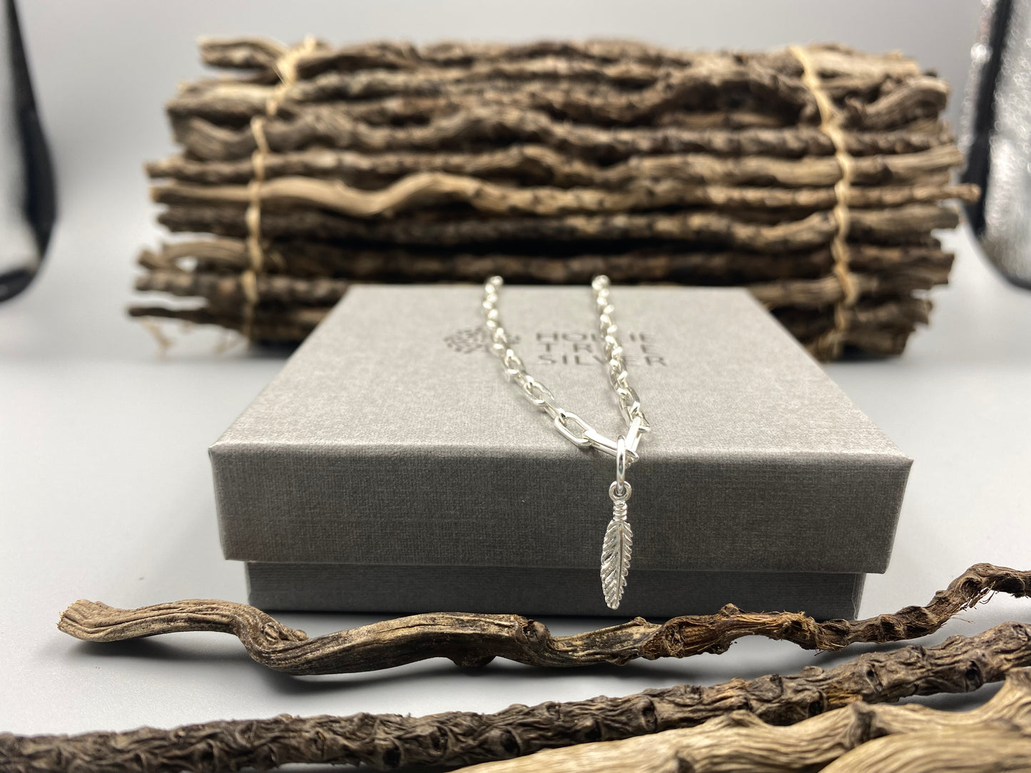 Feather charm trace chain necklace in Sterling Silver