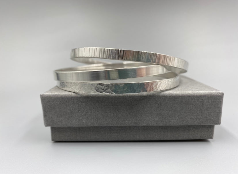 Sterling silver linear texture flat stacker bangle