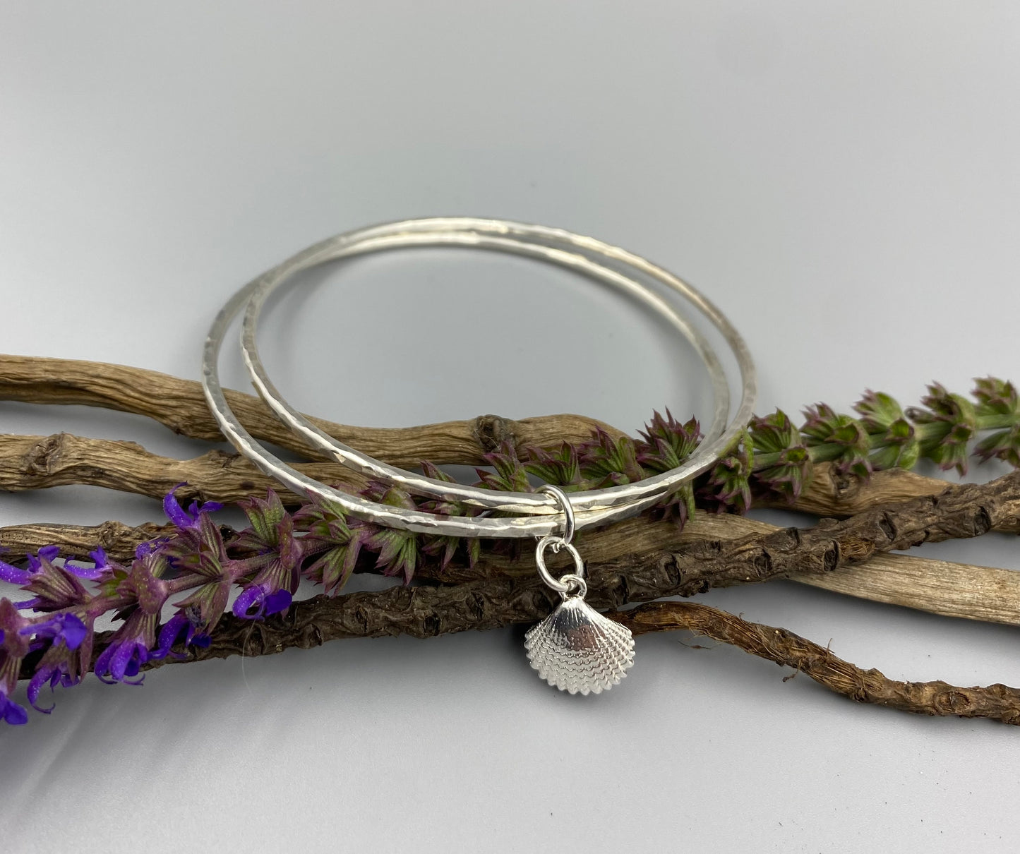 Sterling silver double dimple texture stacker bangle with scallop shell charm
