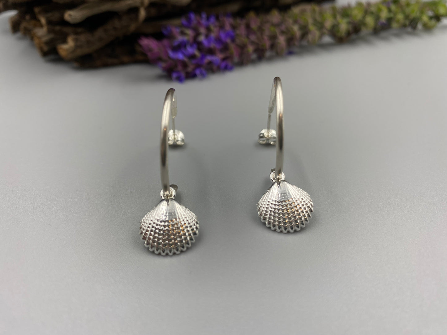 Half hoop earrings with our scallop charm in Sterling Silver
