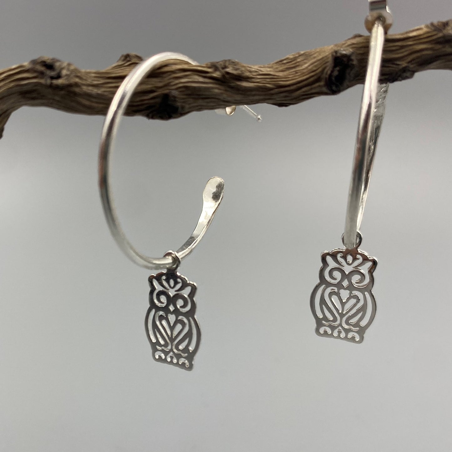Half hoop earrings with our owl charm in Sterling Silver