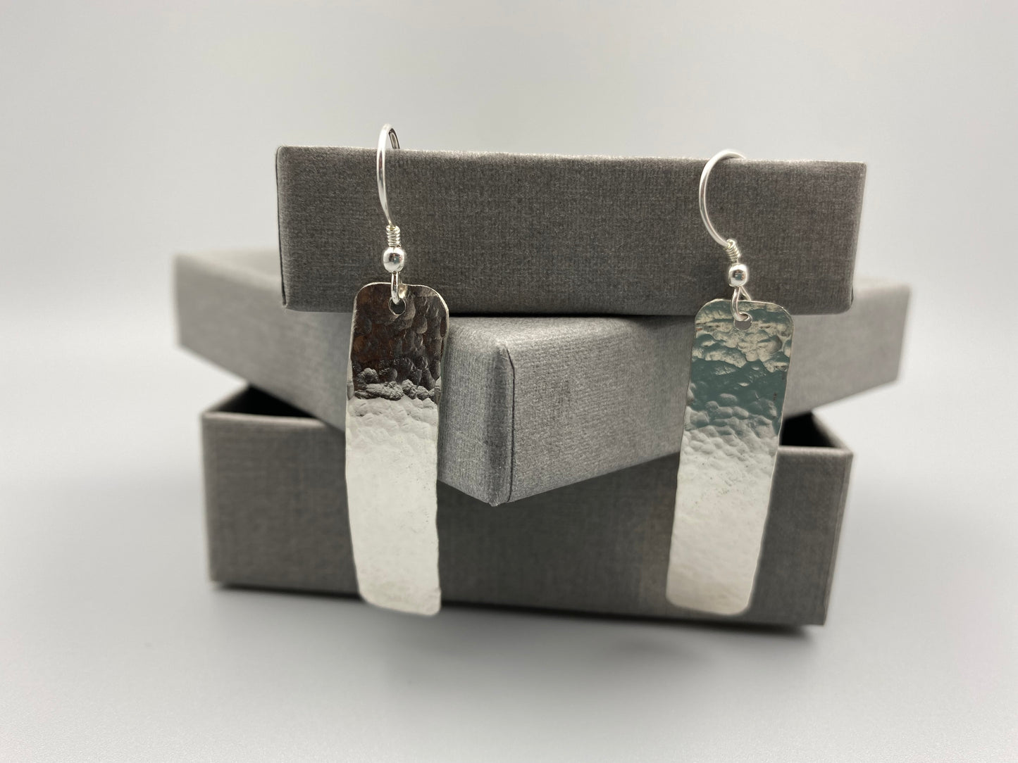 Sterling silver dimple textured long drop earrings