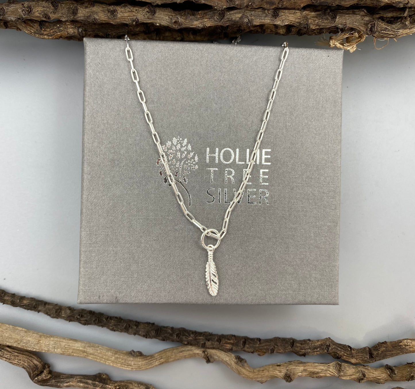 Feather charm skinny trace chain necklace in Sterling Silver