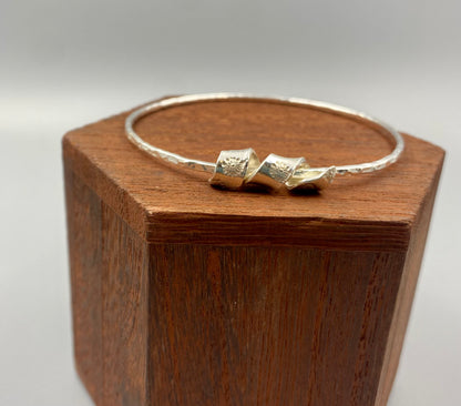 Daisy swirl dimpled bangle in Sterling Silver - April Birthday