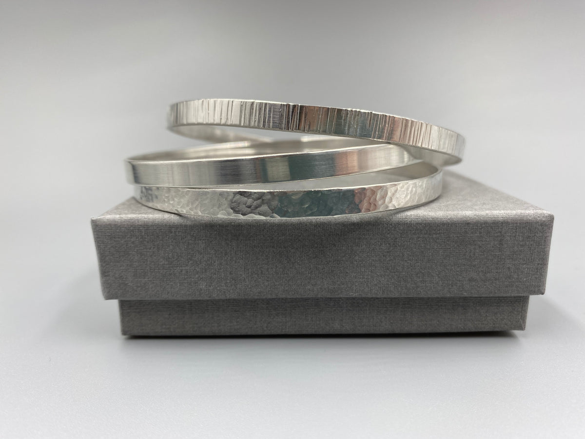 Dimple Stacker Sterling silver dimple flat stacker bangle – Hollie Tree