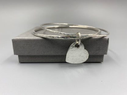 Sterling silver dimple texture double bangle with a heart charm