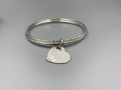 Sterling silver dimple texture double bangle with a heart charm